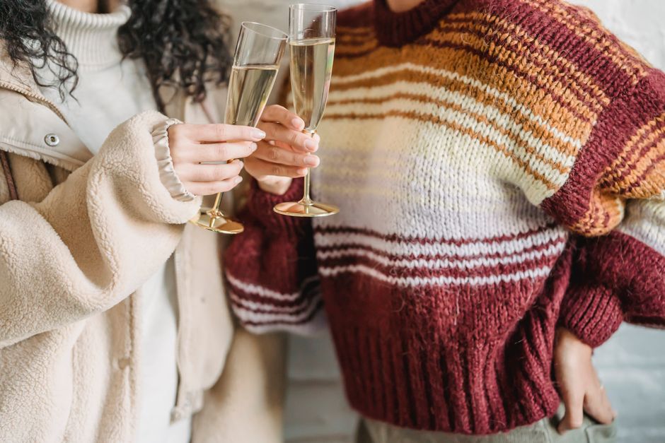 Guests toasting wine glasses at a private buffet event